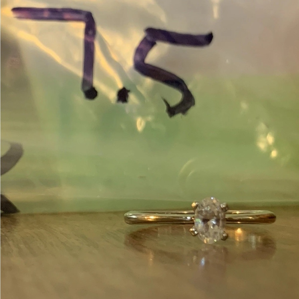 Silver and White Solitaire Ring with Prong Setting